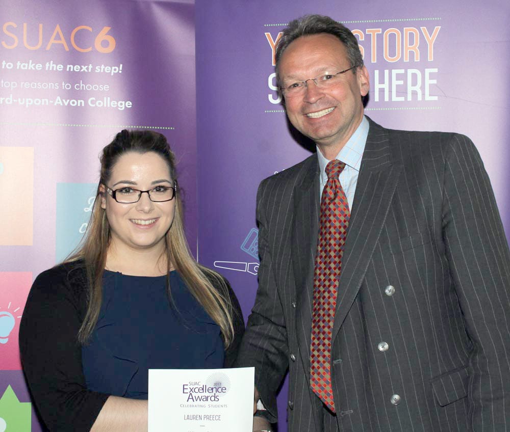 Business Support Apprentice Lauren Preece congratulated by College Principal and CEO Andrew Cropley.