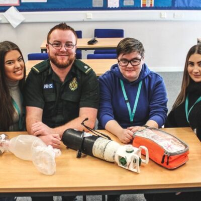Paramedic James Barry (third from left) with Health & Social Care students (left to right) Chelsea Stokes, Millie Timmins, Ethan Meddoms, Ellie Campbell and Nurell Carter