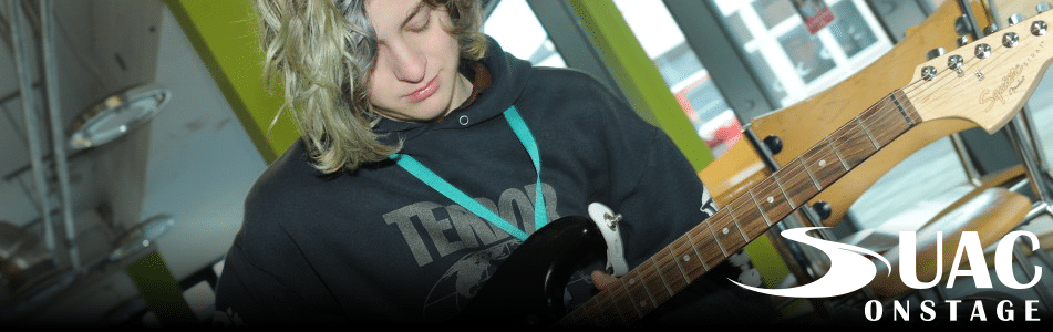 Music student plays guitar