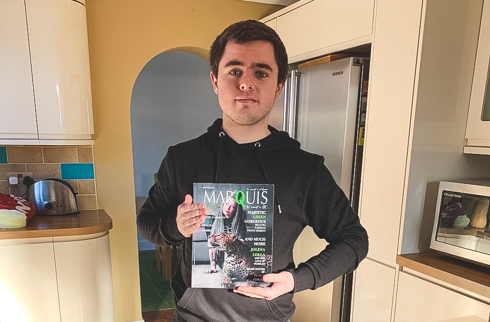 graphic Design student holding magazine