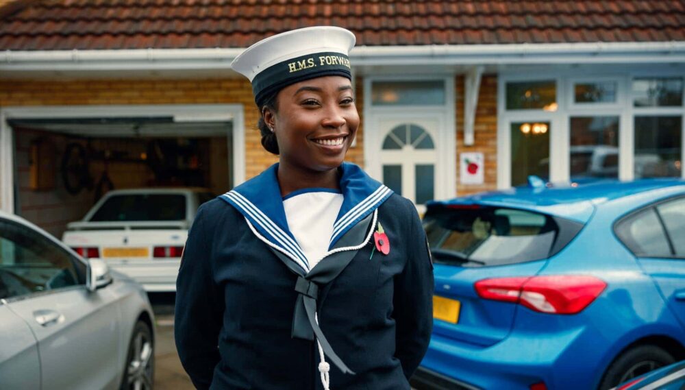 Nicole Smiling as she stands in her Naval Uniform