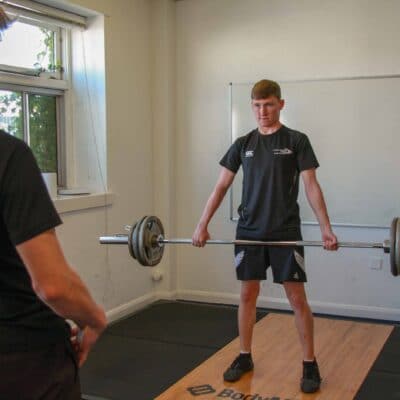 student lifting weights at Stratford-Upon-Avon College