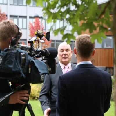 John in front of TV cameras at stratford-upon-avon college