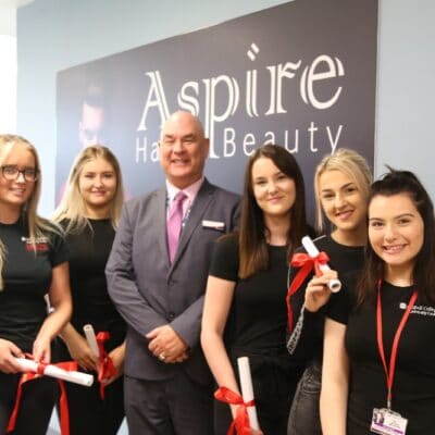 John with Hair & Beauty students at stratford-upon-avon college