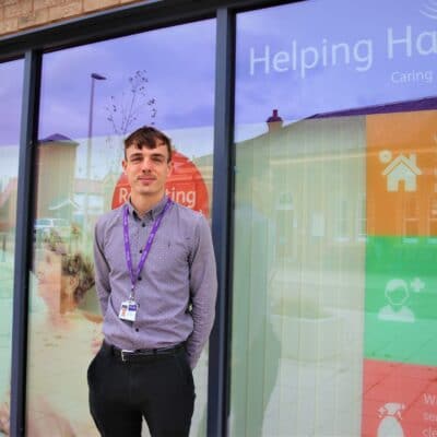 Brandon Shiels outside Helping Hands branch at stratford-upon-avon college