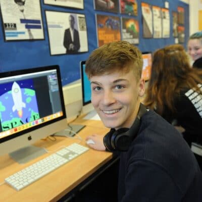 Computer student studying graphic design on adobe software at stratford-upon-avon college