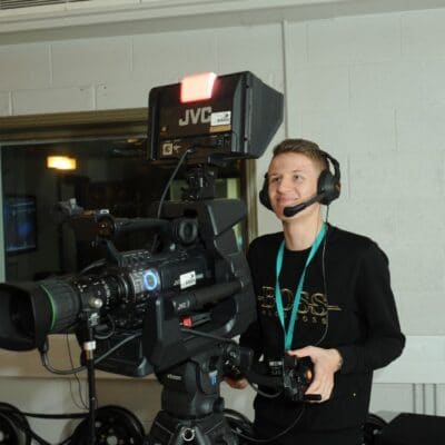 Media student with TV camera at Stratford-upon-Avon College