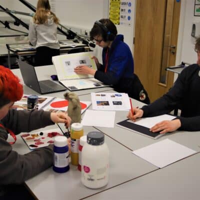 Level 2 Art Students drawing, painting and working on designs