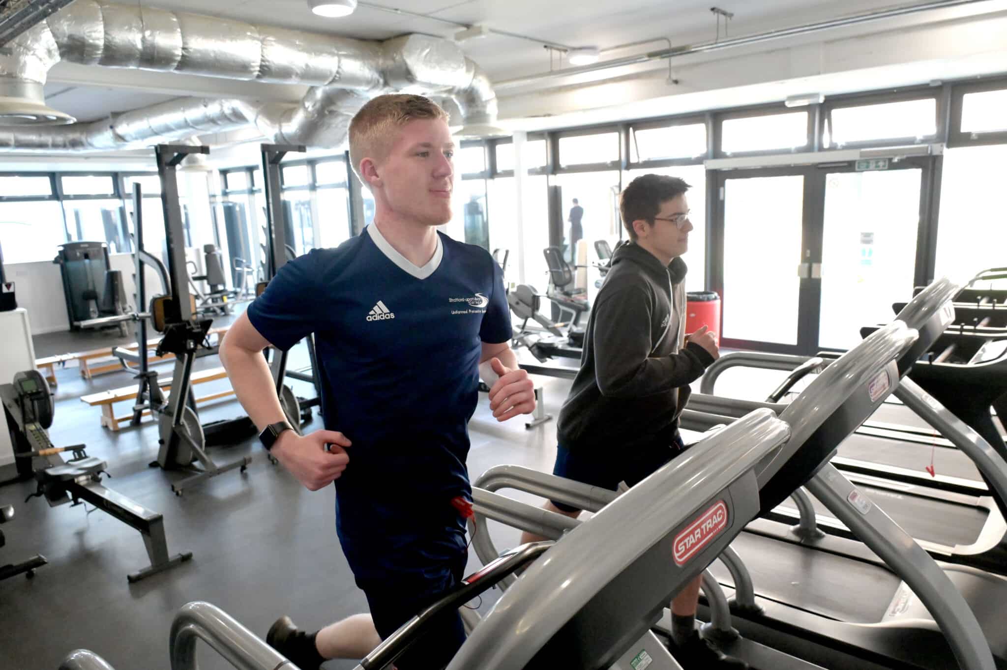 College showcases brand new campus - students at the gym