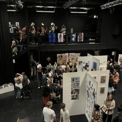 visual arts exhibition with audience looking