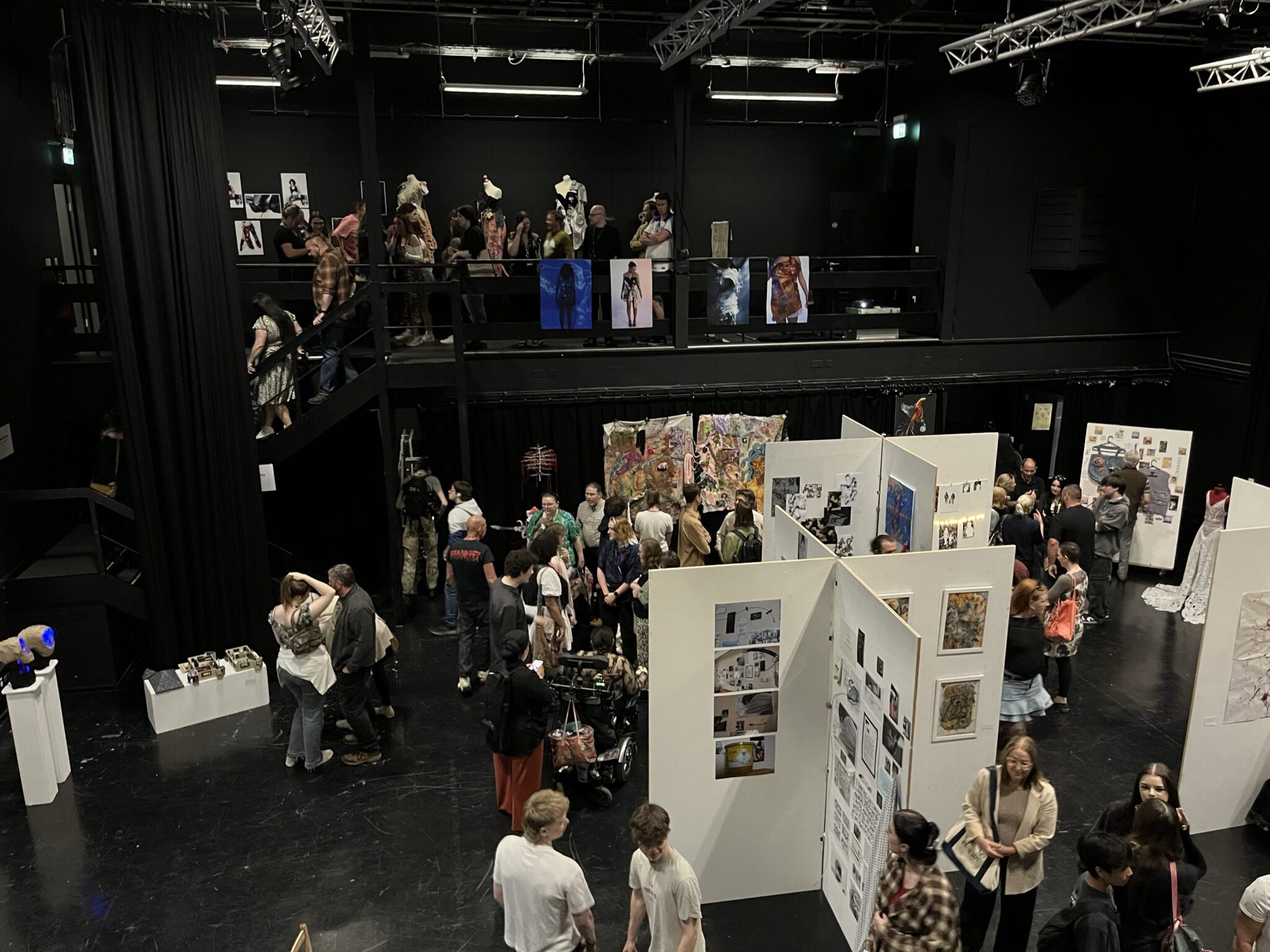 visual arts exhibition with audience looking