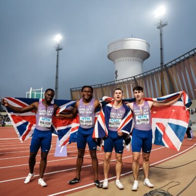 Sport student brings home World Championship medal - Four GB Athletes holding Great Britain Flag