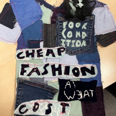 Fast Fashion protest banner in style of a t-shirt.