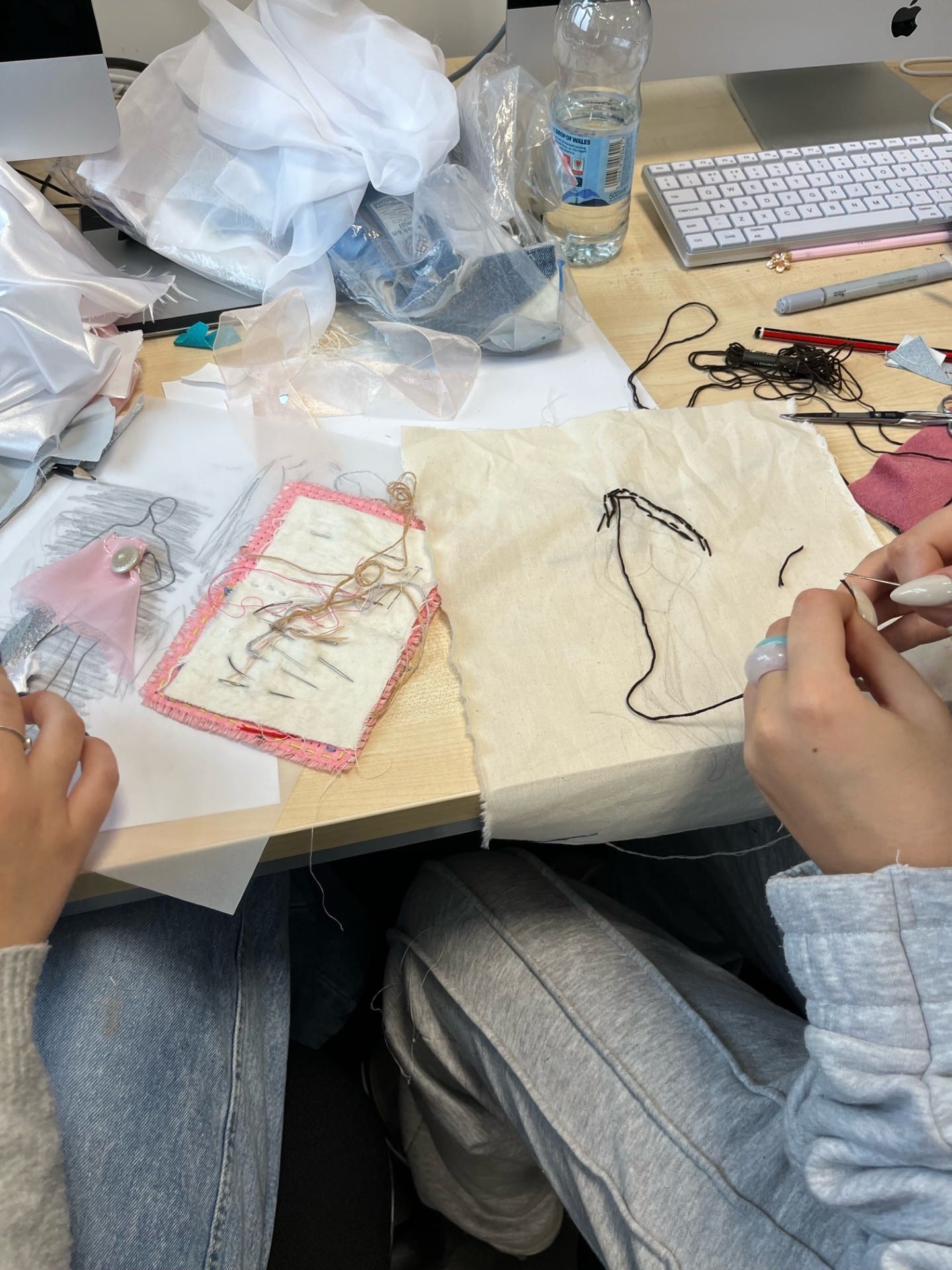 Fashion students explore dangers of fast fashion - Student working on a fashion banner