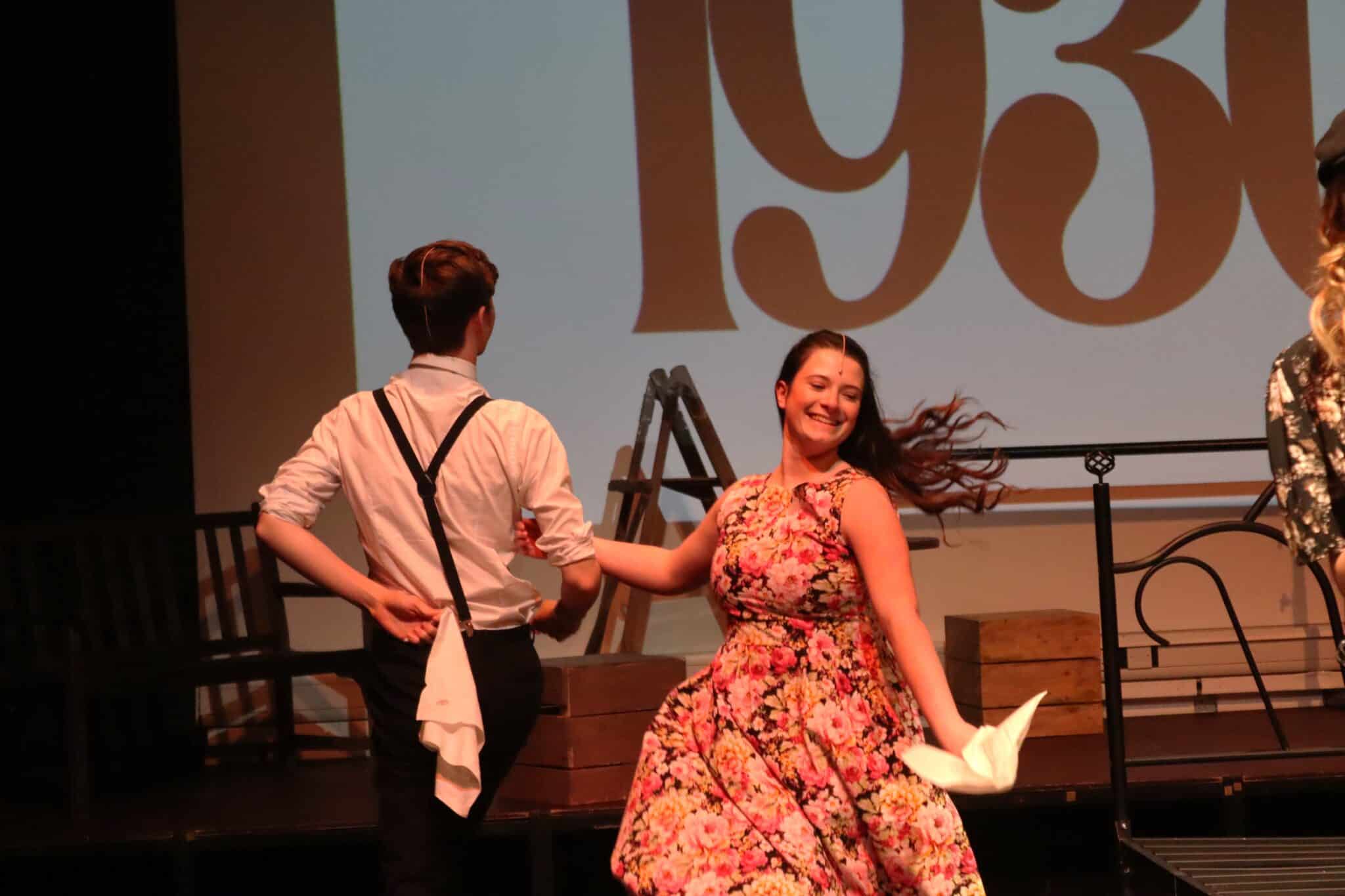 Two people dancing on stage